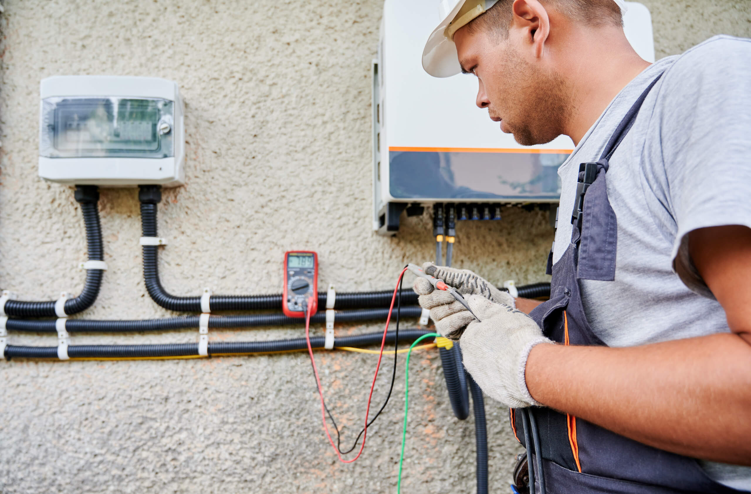 A solar inverter being installed on a home in Phoenix, AZ.